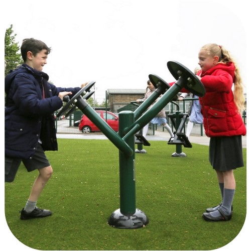 Children using tai chi disks as part of a social outdoor gym equipment set for kids